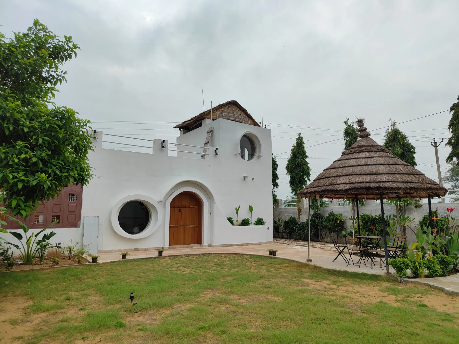 Casa Luna with its lawn and thatched gazebo