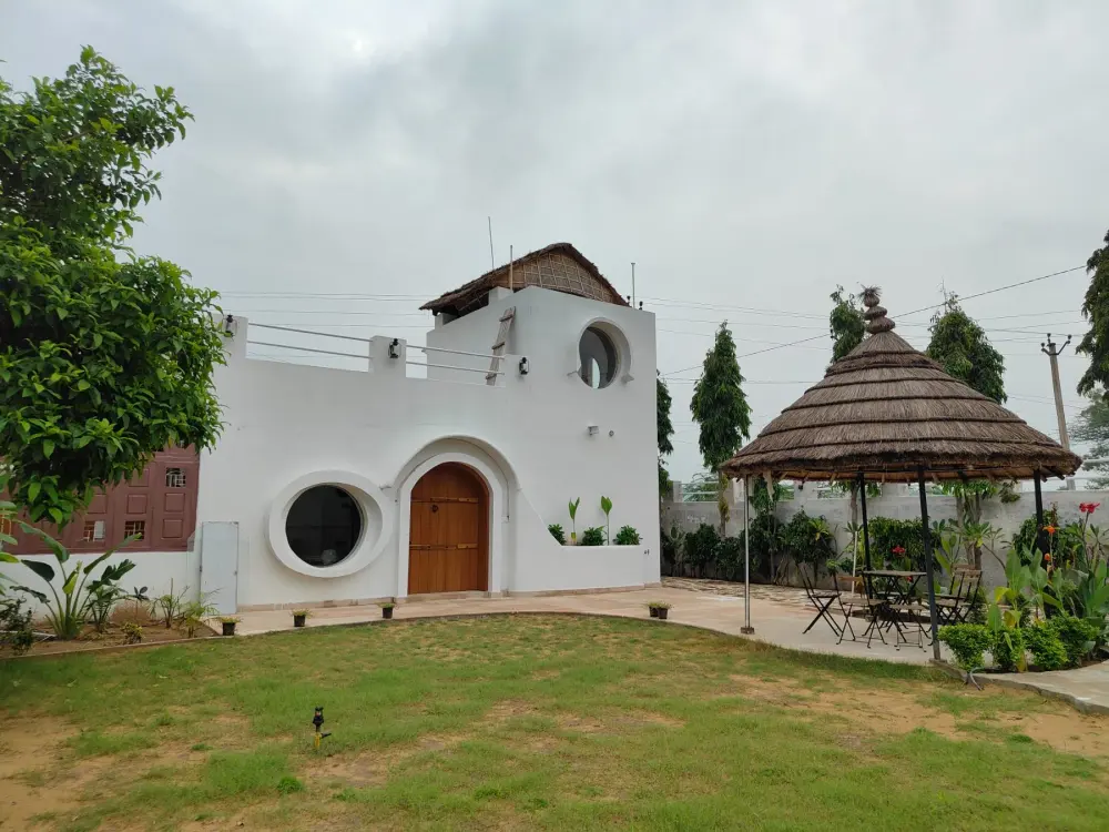 Casa Luna with its lawn and thatched gazebo